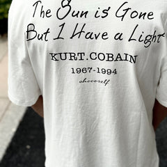Unisex Vintage T Shirts Nirvana short-sleeve tee featuring a West Coast street-style graffiti and hip-hop aesthetic; crafted from heavyweight fabric with a distressed wash finish and direct-to-garment white ink printing.