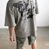 Unisex Vintage T Shirts SAINT MICHAEL x CHO Omnipotent Limited Edition ¨C High-Street Short-Sleeve Tee featuring Direct-to-Garment (DTG) white ink printing, heavy-duty distressed wash finish, and a unique cement-grey colorway.